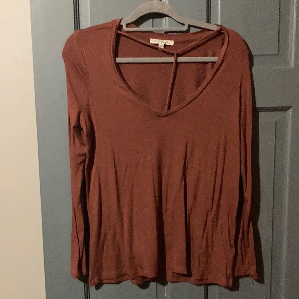 Express long sleeve burgundy shirt with beautiful neck design.